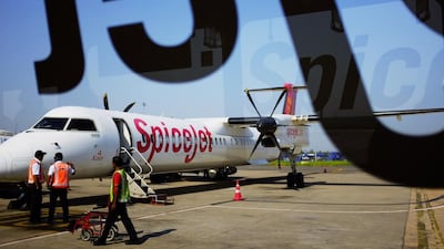 A Bombardier Q400 turboprop airliner belonging to the Indian airline SpiceJet. Rival propeller plane maker ATR claims Bombardier has received unfair state funding. Roberto Schmidt / AFP