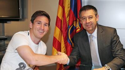 Josep Maria Bartomeu, pictured with Lionel Messi, is the current president having taken over from Sandro Rossell following his resignation last year. Bartomeu is considered the slight favourite ahead of Joan Laporta. Miguel Ruiz / AFP