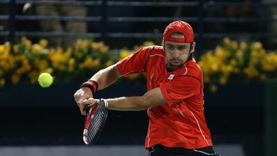 Benjamin Becker playing against Roger Federer during the first round match of Dubai Duty Free Tennis Championships at Dubai Duty Free Tennis stadium in Dubai on February 24, 2014. Federer went on to beat Becker 6-1, 6-4. Pawan Singh / The National