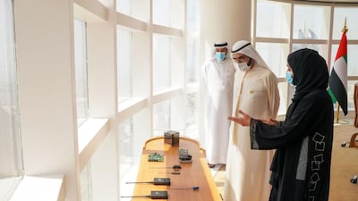 Sheikh Mohammed bin Rashid speaks to members of the team launching the Ghalib satellite