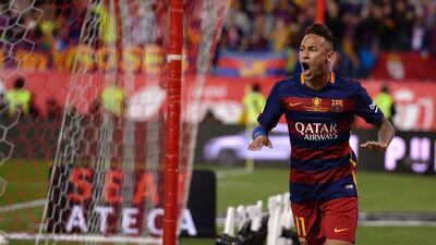 Neymar wheels away in celebration after scoring Barcelona's second goal in extra time to claim the Copa del Rey 2-0 over Sevilla. Josep Lago / AFP