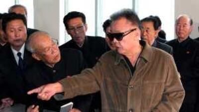 A photograph released yesterday of the North Korean leader, Kim Jong-il, who has threatened war over any sanctions imposed upon his country after an inquiry found that it had torpedoed a South Korean warship.