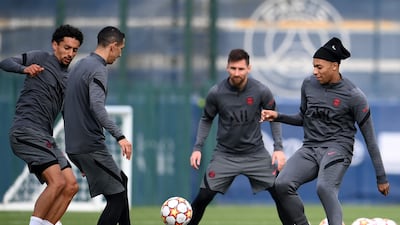 Marquinhos, Angel Di Maria, Lionel Messi and Kylian Mbappe take part during a training session at the Camp des Loges training ground. AFP