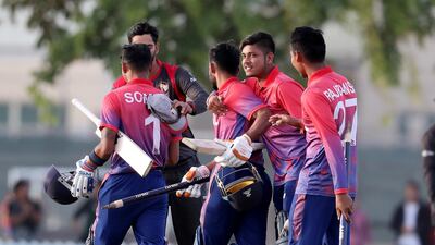 Nepal players celebrate their win against the UAE. Pawan Singh/The National