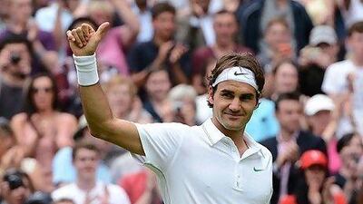 Switzerland's Roger Federer celebrates his second round victory over Italy's Fabio Fognini
