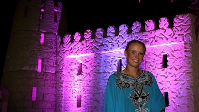 Wozniacki poses in traditional Emirati dress during the player's party on Tuesday. Warren Little / Getty Images