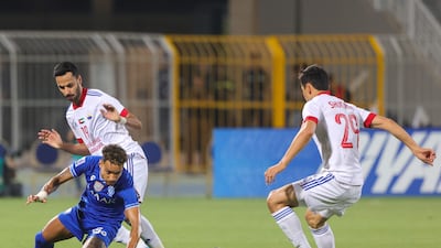 Hilal midfielder Matheus Pereira is marked by Sharjah defender Khaled Ibrahim and midfielder Otabek Shukurov.