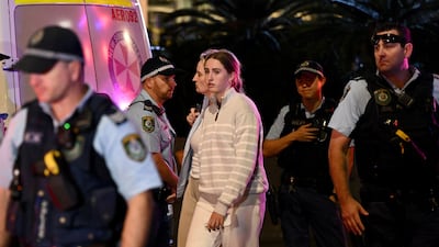 Members of the public are escorted by police. EPA