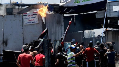 Protesters clash with anti-riot police on the Al-Jumhuriya bridge, which leads to the headquarters of the Iraqi government inside the high security Green Zone area, during an anti-government protest in Baghdad, Iraq. EPA