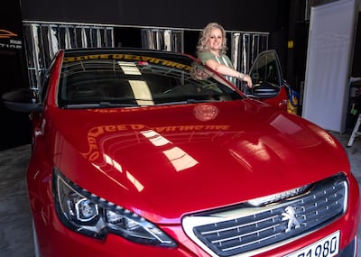 Trina Mole swapped her big engine Dodge Nitro for a humble Peugeot 306. Victor Besa / The National