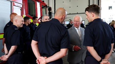 King Charles meets representatives from Merseyside's emergency services and local community groups at the Community Fire Station in Southport. AFP