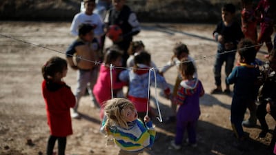 Displaced Iraqi children who fled ISIL stronghold Mosul with their families play at Khazer camp, Iraq. Muhammad Hamed / Reuters