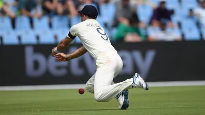 England bowler James Anderson dives in vain to catch Quinton de Kock . Getty Images