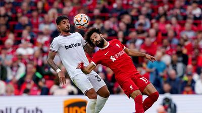 Liverpool's Mohamed Salah fights for the ball with West Ham United's Emerson Palmieri. PA