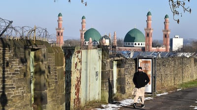 A man walks past Al-Jamia Suffa-Tul-Islam Grand Mosque in Bradford. Getty Images