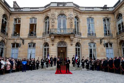 Gabriel Attal, right, delivers his speech as France's new Prime Minister as his predecessor Elisabeth Borne looks on. Pool/AP