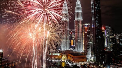 Fireworks illuminate the night sky over Malaysia's Petronas Towers during New Year's Eve celebrations in Kuala Lumpur. EPA