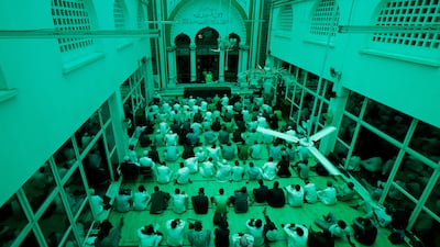 Muslim worshippers are cast in green light from Jamia Mosque's roof canopy, as they attend the first Friday prayers of the holy month in Nairobi, Kenya. Reuters