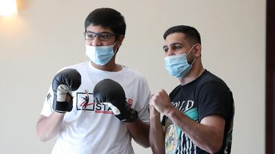 Amir Khan posing for the photo with Dinal Ekanayake. Pawan Singh / The National