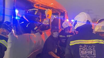 Police and ambulance workers at the scene of the crash on Emirates Road in Dubai on Saturday. Courtesy: Dubai Police