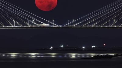 The supermoon shines behind the Rande bridge in Vigo, Spain. EPA