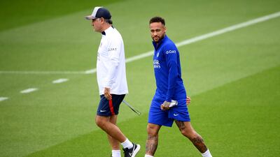 PSG manager Christophe Galtier, left, and Neymar arrive for a training session at the club's training ground in Saint-Germain-en-Laye on Tuesday, September 13, 2022. AFP