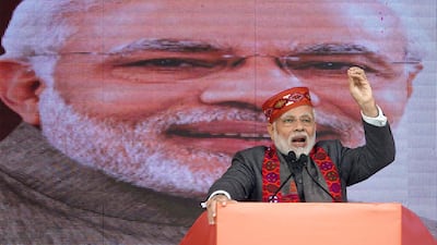 Indian Prime Minister Narendra Modi addresses the gathering during a BJP rally. EPA