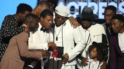 Bobby Brown, centre, and the cast of New Edition present the award for best actress at the BET Awards. Matt Sayles / Invision / AP