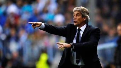 Malaga coach Manuel Pellegrini will attend his father's funeral in his native Chile before he re-joins his team for the Germany tilt. Daniel Tejedor / AP Photo