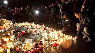 Hundreds of supporters mourn the death of Germany's national team goalkeeper Robert Enke in front of the Hannover 96 stadium.