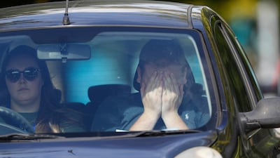 A worker reacts as he is driven from the Thomas Cook Headquarters in Peterborough, United Kingdom. Getty Images