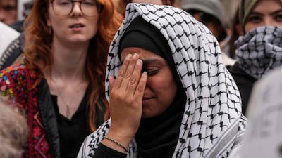 People listen to the court proceedings outside the Royal Courts of Justice. AFP