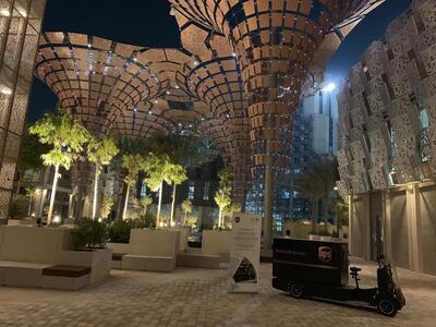 The electric vans and e-quads - a combination of a crate on a quadbike - will help reduce carbon emissions. Courtesy: UPS