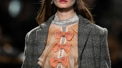 Bow detailing at the runway show. AFP