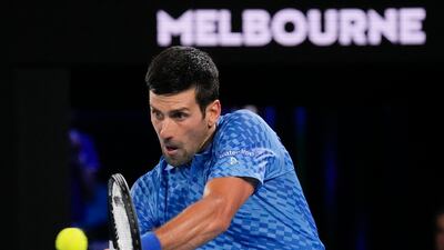 Novak Djokovic plays a backhand return to Roberto Carballes Baena. AP
