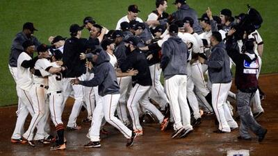 The San Francisco Giants celebrate after advancing to the World Series with a 9-0 win against St Louis to take their championship series