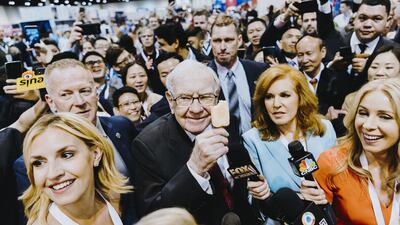 Warren Buffett (C), CEO of Berkshire Hathaway, at the firm's annual meeting in Omaha. Bloomberg