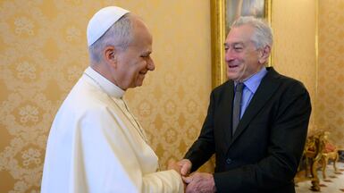 Pope Leo XIV speaks with actor Robert De Niro at the Vatican. EPA