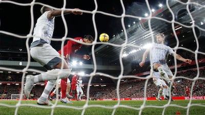 Liverpool's Virgil van Dijk scores their first goal. Reuters