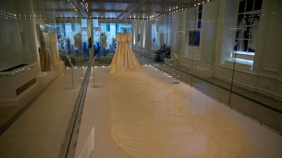 The dress has a 7.6-metre sequin-encrusted train, which is the longest in British royal history to date. AP Photo