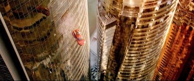 In one of the most daring stunts, the stunt car crashes out of Etihad Towers, before smashing in to another of the towers and then repeating the jump to a third tower. Courtesy: ADFC/twofour54