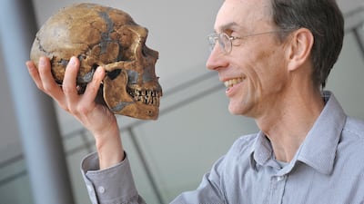 Nobel Prize winner Svante Paabo channels Hamlet by holding and staring at a skull in this picture taken in Leipzig, Germany, in 2010. Reuters