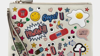 Anya Hindmarch playfully covers a purse in cartoon-esque badges. Courtesy Anya Hindmarch