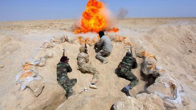 Shi'ite fighters are aiding the Iraqi army battle against ISIL militants. Photo: Alaa Al-Marjani / Reuters