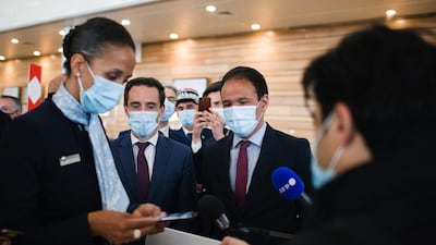 Air France-KLM check-in staff demonstrate the 'TousAntiCovid' smartphone tracing app at Orly Airport in Paris last week. France is moving towards a rollout of digital health certificates. Bloomberg