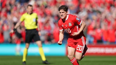 Dan James of Wales celebrates after he scores against Slovakia in Cardiff on Sunday. Catherine Ivill / Getty Images
