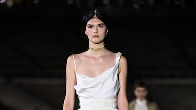A model walks the runway during the Dior Cruise show 2022 at Panathenaic Stadium on June 17, 2021 in Athens, Greece. AFP