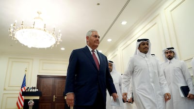 US secretary of state Rex Tillerson departs with Qatar's foreign minister, Sheikh Mohammed bin Abdulrahman Al Thani, after a press conference in Doha on October 22, 2017. Alex Brandon / Pool / Reuters