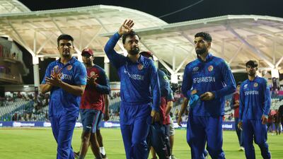 Afghanistan's Rashid Khan and teammates after losing to South Africa in the T20 World Cup semi-final in Trinidad. Reuters