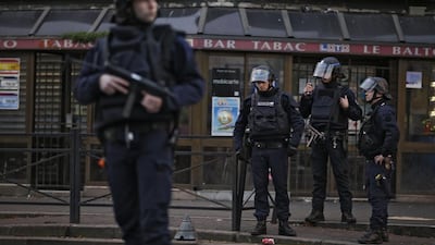 French army soldiers stand in position in the northern Paris suburb of Saint-Denis, as French Police special forces raid an appartment, hunting those behind the attacks that claimed 129 lives in the French capital five days ago. Kenzo Tribouillard / AFP